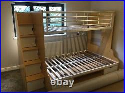 Bunk beds with mattresses and storage