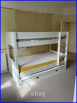 Bunk beds with mattresses and storage