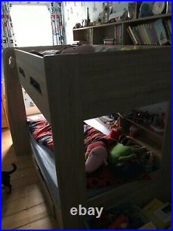 Kids bunk bed with shelves
