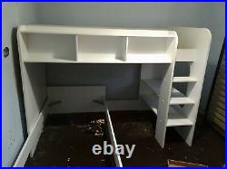 White bunk bed with storage shelves and play/ study area. Shelves/ ladder