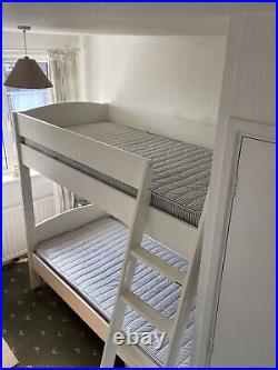 White wooden bunk beds with mattresses. Great condition