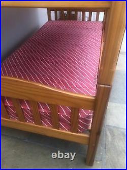 Wooden bunk beds with mattresses